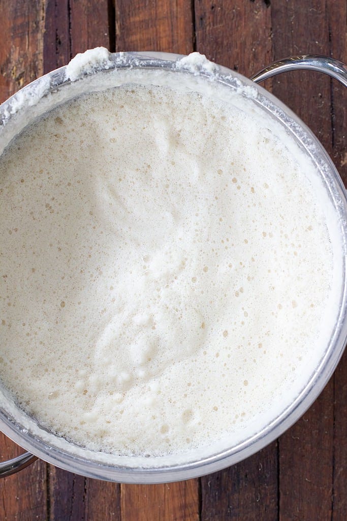 Heated soy milk after blending after frothy head has formed